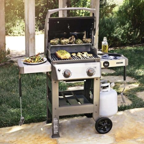 Square side shot of a small gas grill.