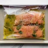 Salmon fillets in a Ziploc bag with a grilled salmon marinade.