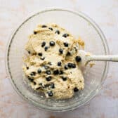 Folding blueberries into sour cream muffin batter.