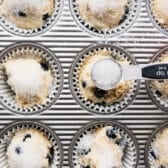 Sprinkling sparkling coarse sugar on top of muffin batter.