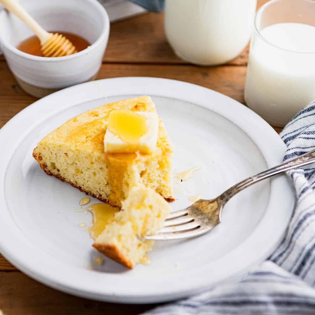 Fork taking a bite of Southern cornbread.