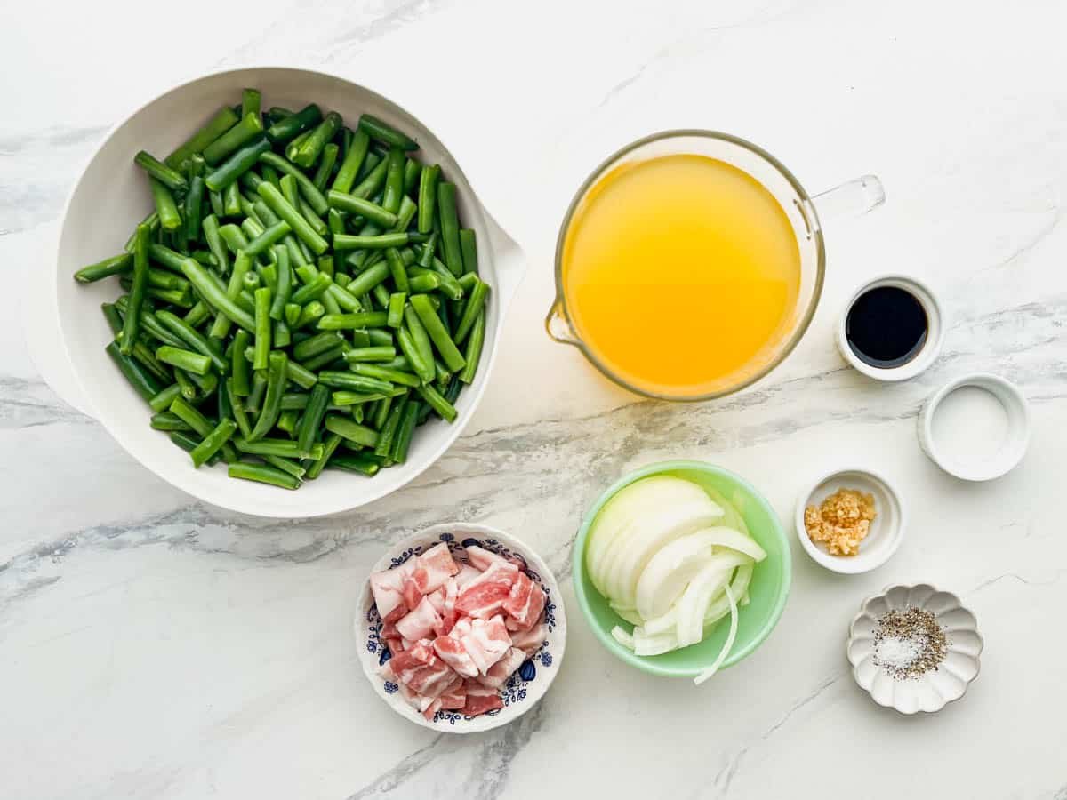 Overhead shot of the ingredients for a Southern style green beans recipe.