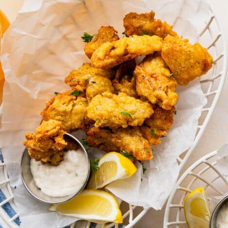 Close up square shot of a basket of fried oysters.