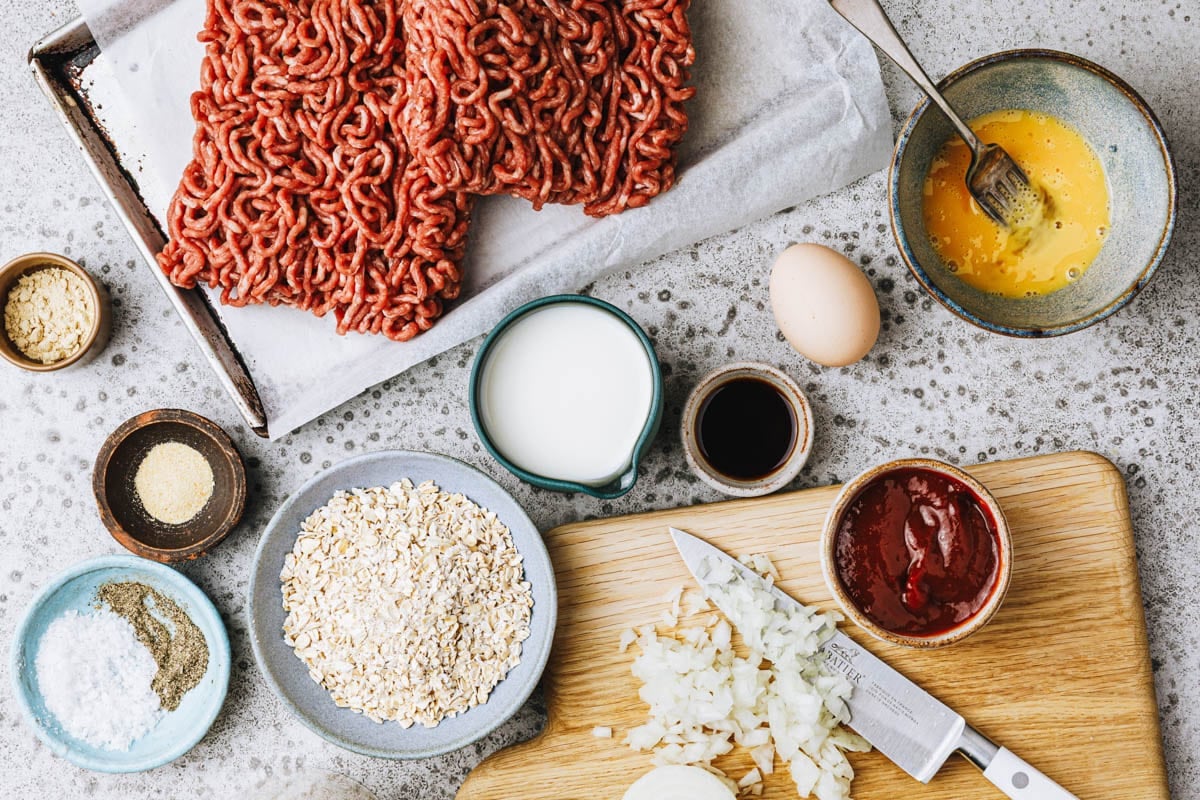 Ingredients for a meatloaf recipe with oatmeal.