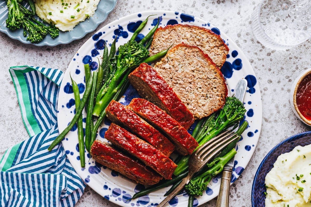 Horizontal overhead shot of a plate of meatloaf with oatmeal.