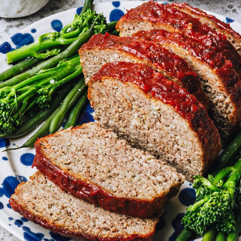 Square side shot of a sliced meatloaf recipe with oatmeal.