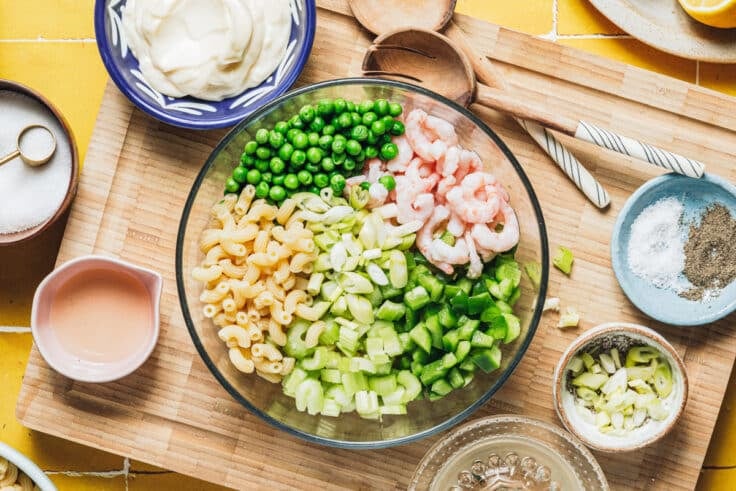Process shot showing how to make shrimp pasta salad.