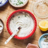 Stirring together the dressing for a shrimp pasta salad recipe.