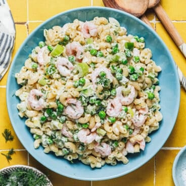 Square overhead shot of a bowl of shrimp pasta salad.