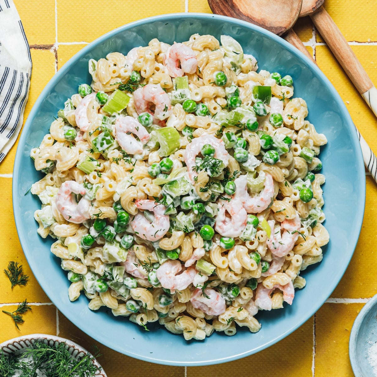 Square overhead shot of a bowl of shrimp pasta salad.