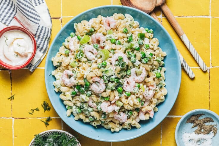 Horizontal overhead shot of a bowl of shrimp pasta salad.