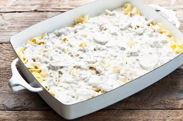 Process shot showing how to make beef stroganoff casserole with cream of mushroom soup.