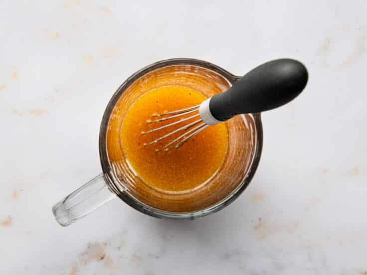 Whisking together a red wine vinaigrette.