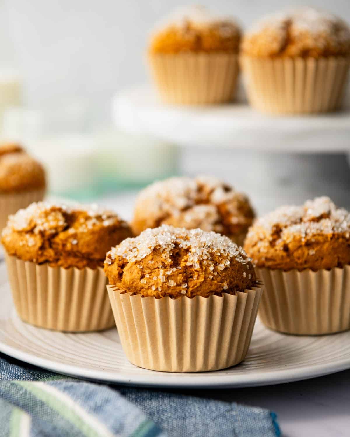 Close up side shot of pumpkin muffins with cake mix on a white serving platter.