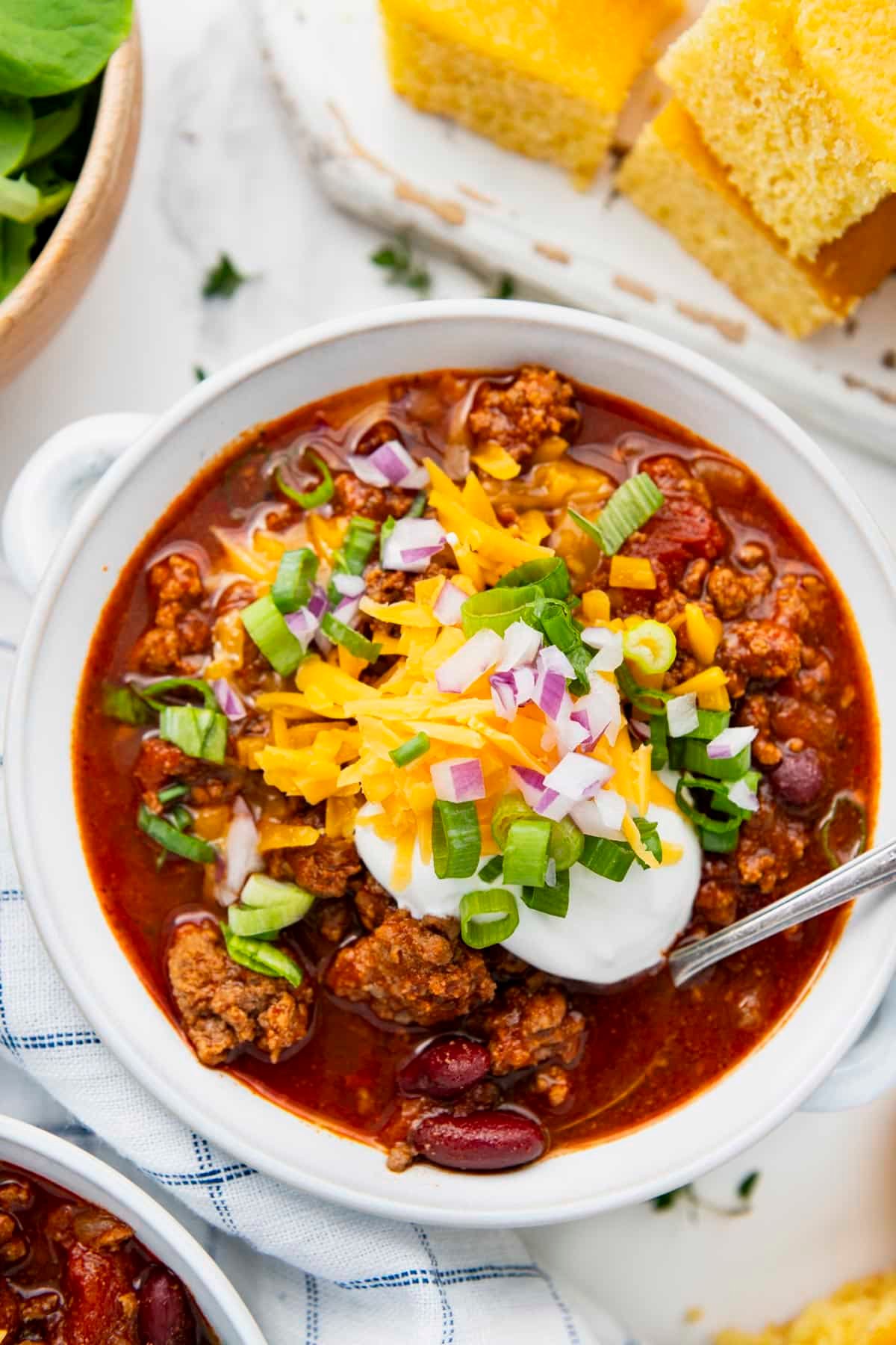 Overhead shot of a white bowl full of the best beef chili recipe.
