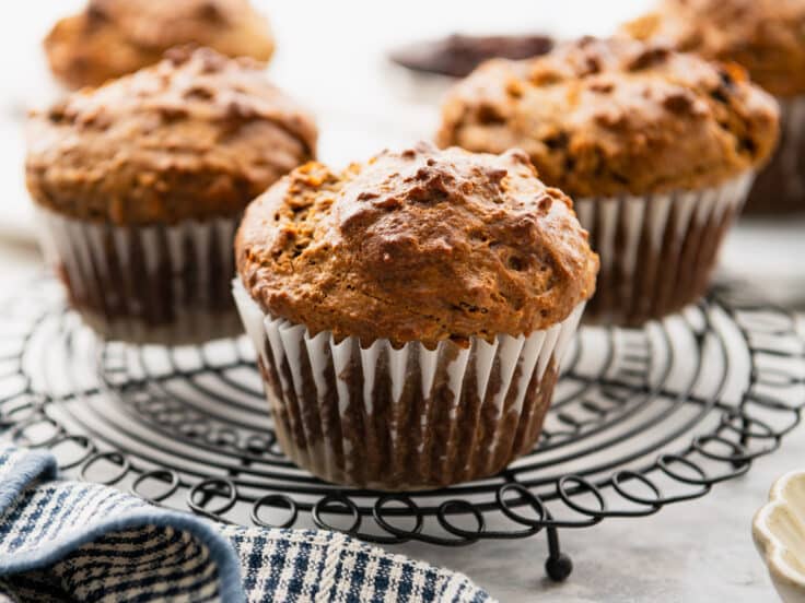 Bran muffins cooling on a wire rack.