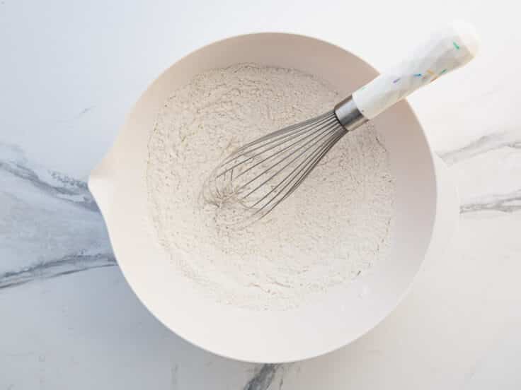Whisking together dry ingredients.