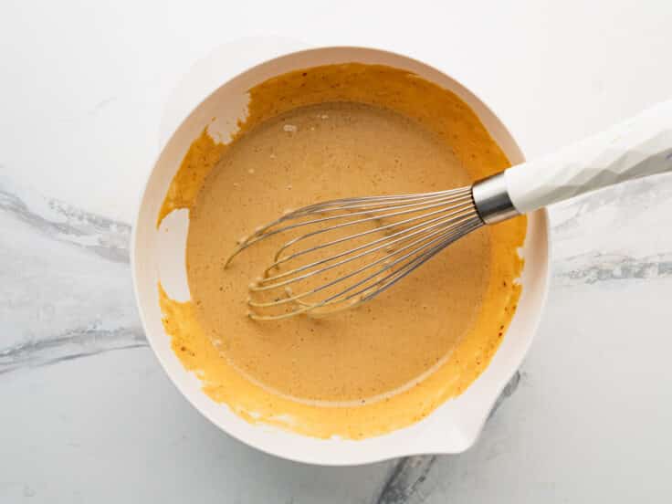 Whisking together wet ingredients.