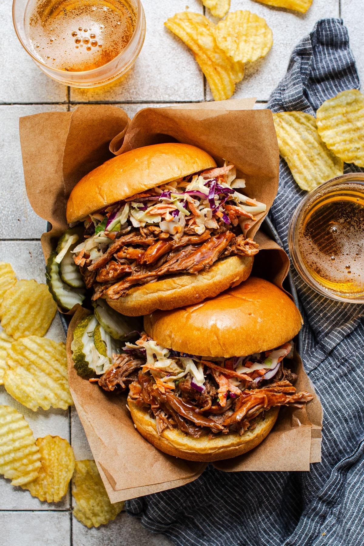Overhead shot of Crock Pot pulled pork sandwiches on a serving tray.