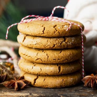 Square side shot of Williamsburg old fashioned ginger cookies on a wooden board.