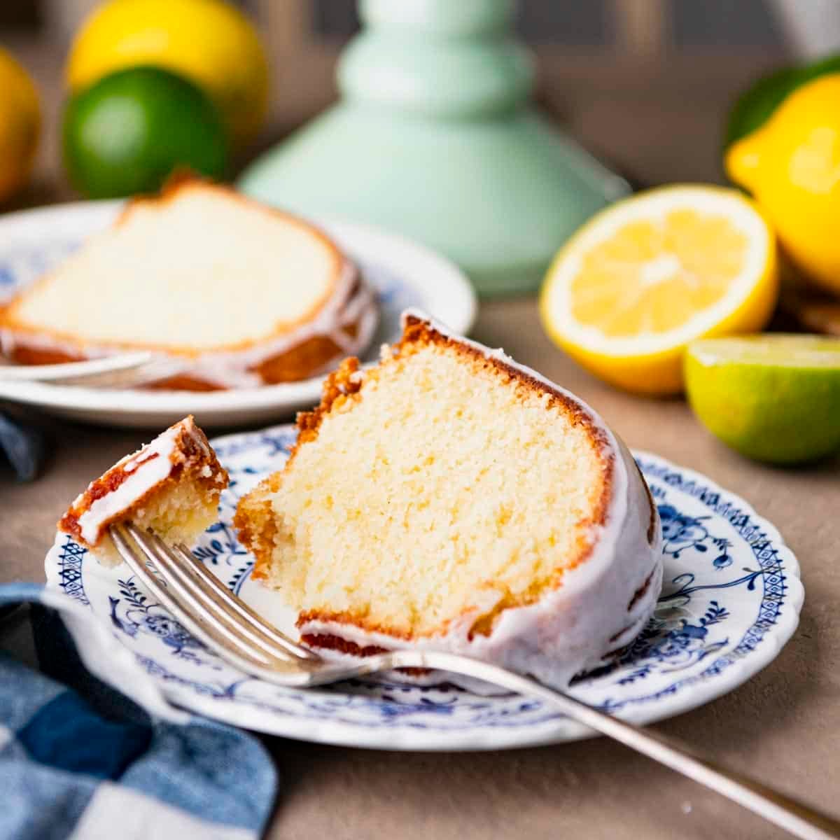 Square side shot of a slice of 7up pound cake on a blue and white plate.