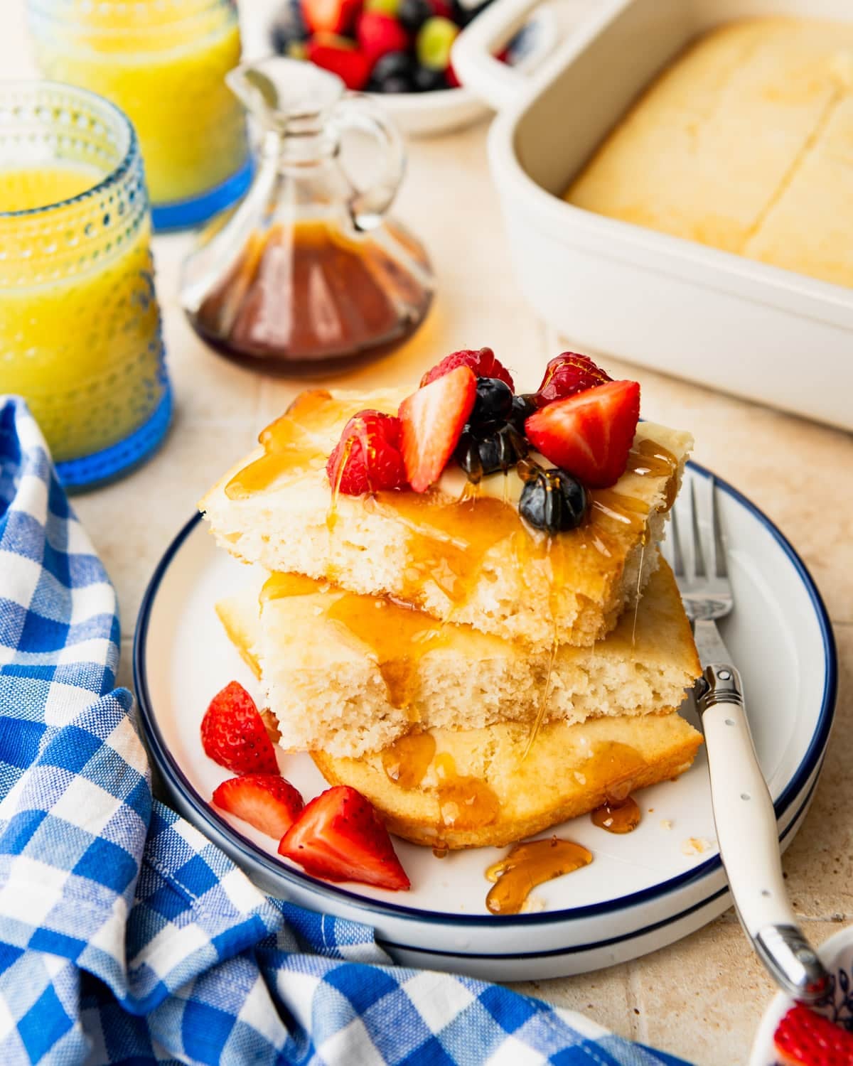 Plate of baked pancakes with pancake mix on a breakfast table.