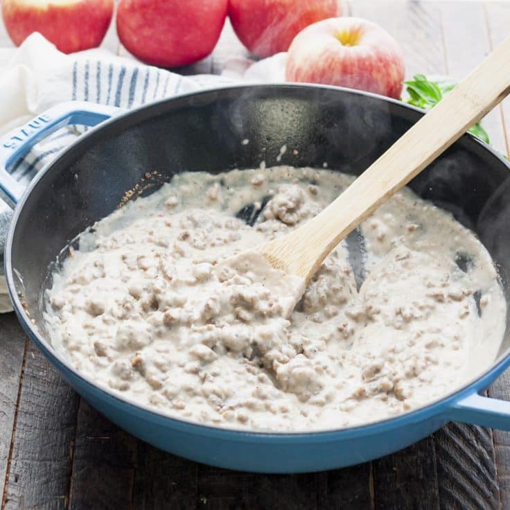 Sausage gravy in a cast iron pan.