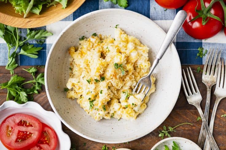 Horizontal overhead shot of a bowl of old fashioned baked macaroni and cheese.
