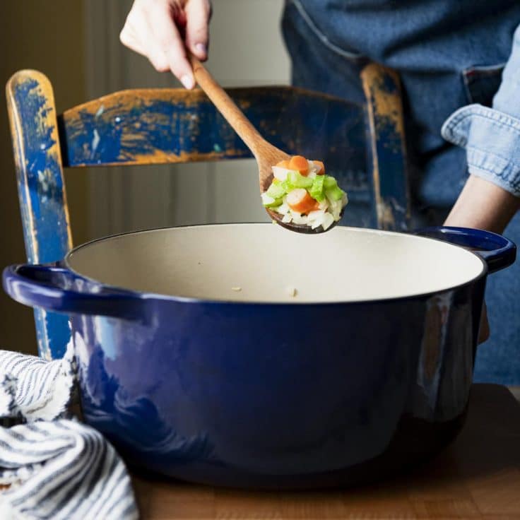 Sauteing carrots and celery in a Dutch oven.