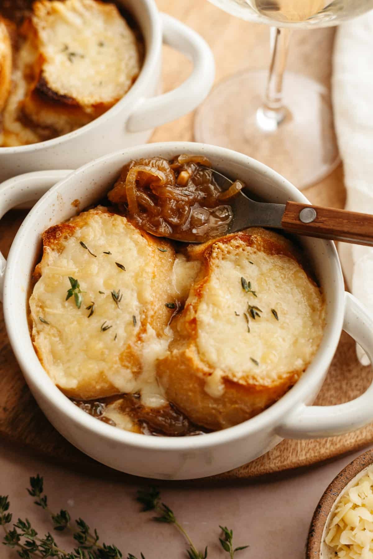 Side shot of a bowl of easy French onion soup.