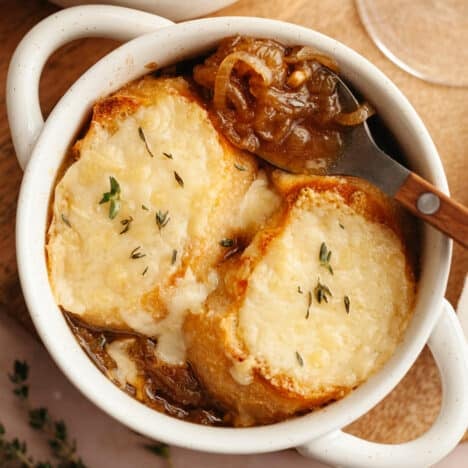 Square overhead shot of a bowl of easy French onion soup.