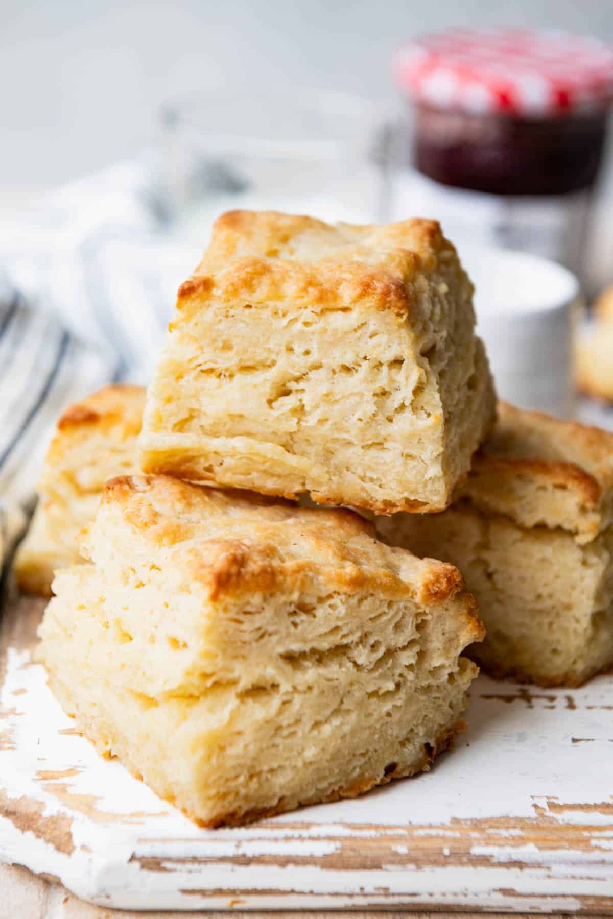 Close up shot of a stack of flaky biscuits.