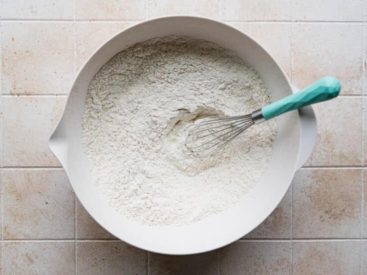 Whisking the dry ingredients for a flaky biscuits recipe.