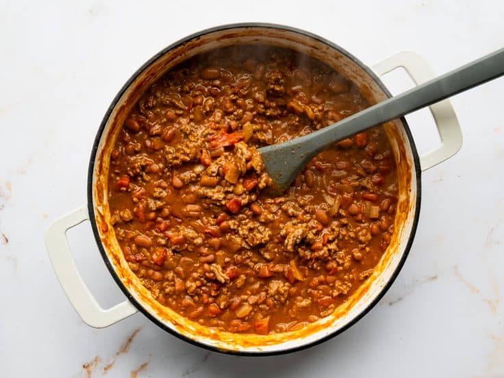 Simmering the filling for Frito pie in a cast iron skillet.