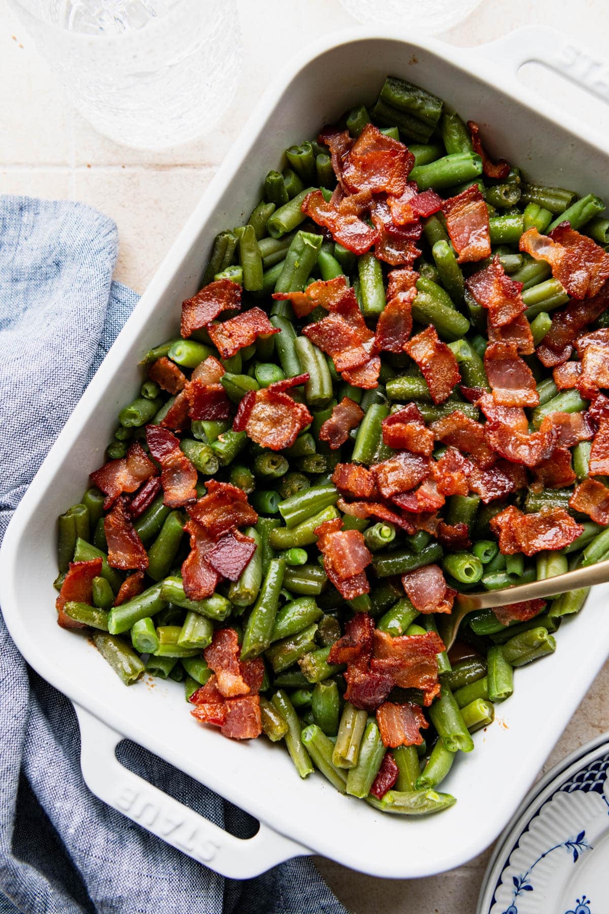 Overhead shot of a white baking dish full of an Arkansas green bean recipe.