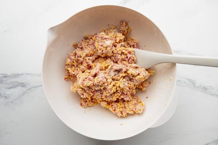 Process shot showing how to make sausage balls with bisquick.