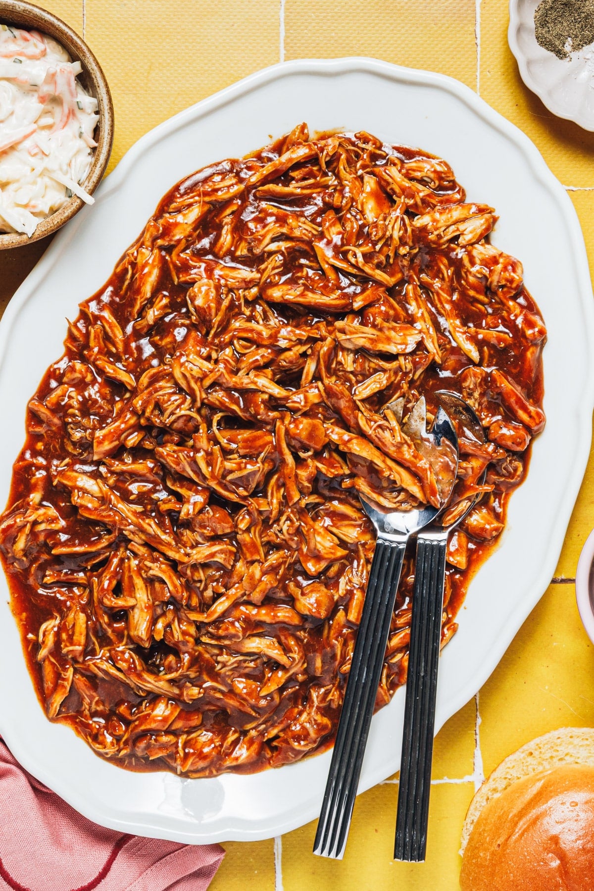 Overhead shot of a serving tray full of slow cooker bbq pulled chicken.
