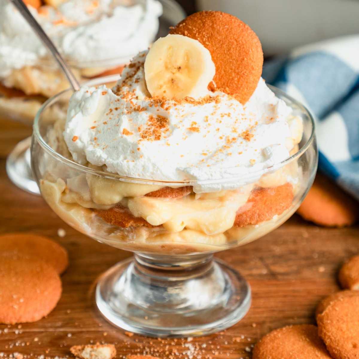 Square close up side shot of easy banana pudding in a glass bowl.