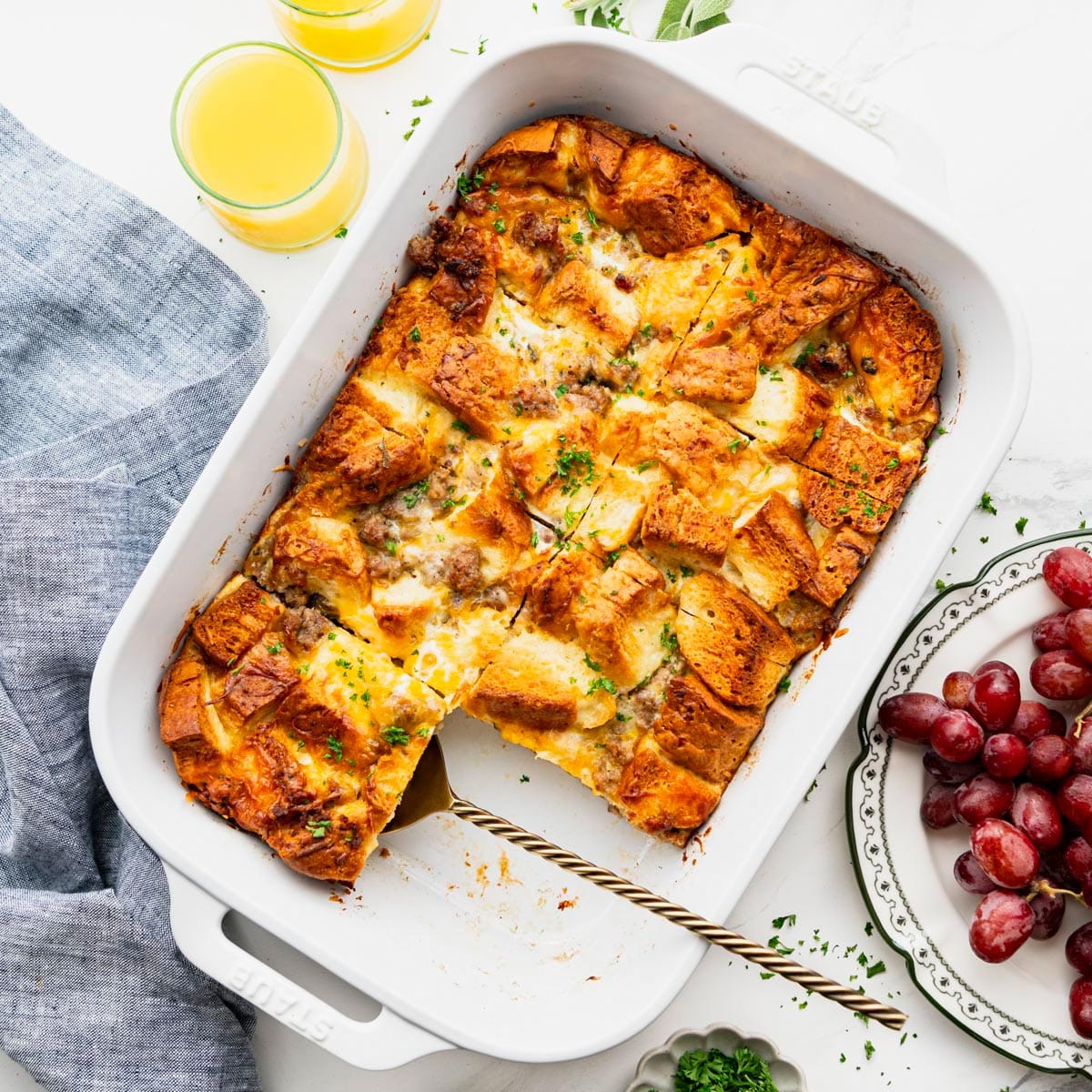 Square overhead shot of a breakfast casserole with Pillsbury biscuits.