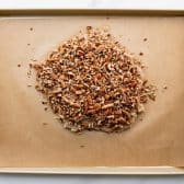 Process shot showing how to make pecan bars.