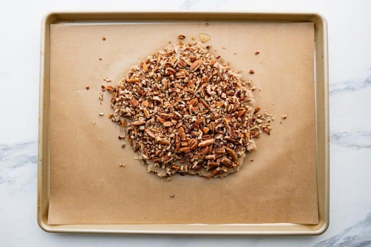 Process shot showing how to make pecan bars.