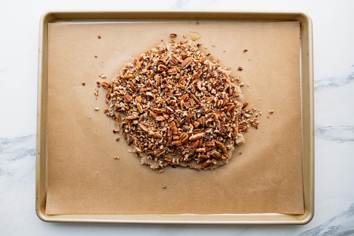 Process shot showing how to make pecan bars.