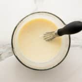 Whisking together the coconut cream soaking mixture.