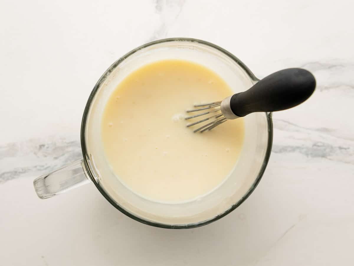 Whisking together the coconut cream soaking mixture.