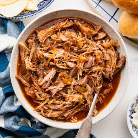 Square overhead shot of a bowl of dr. pepper pulled pork.