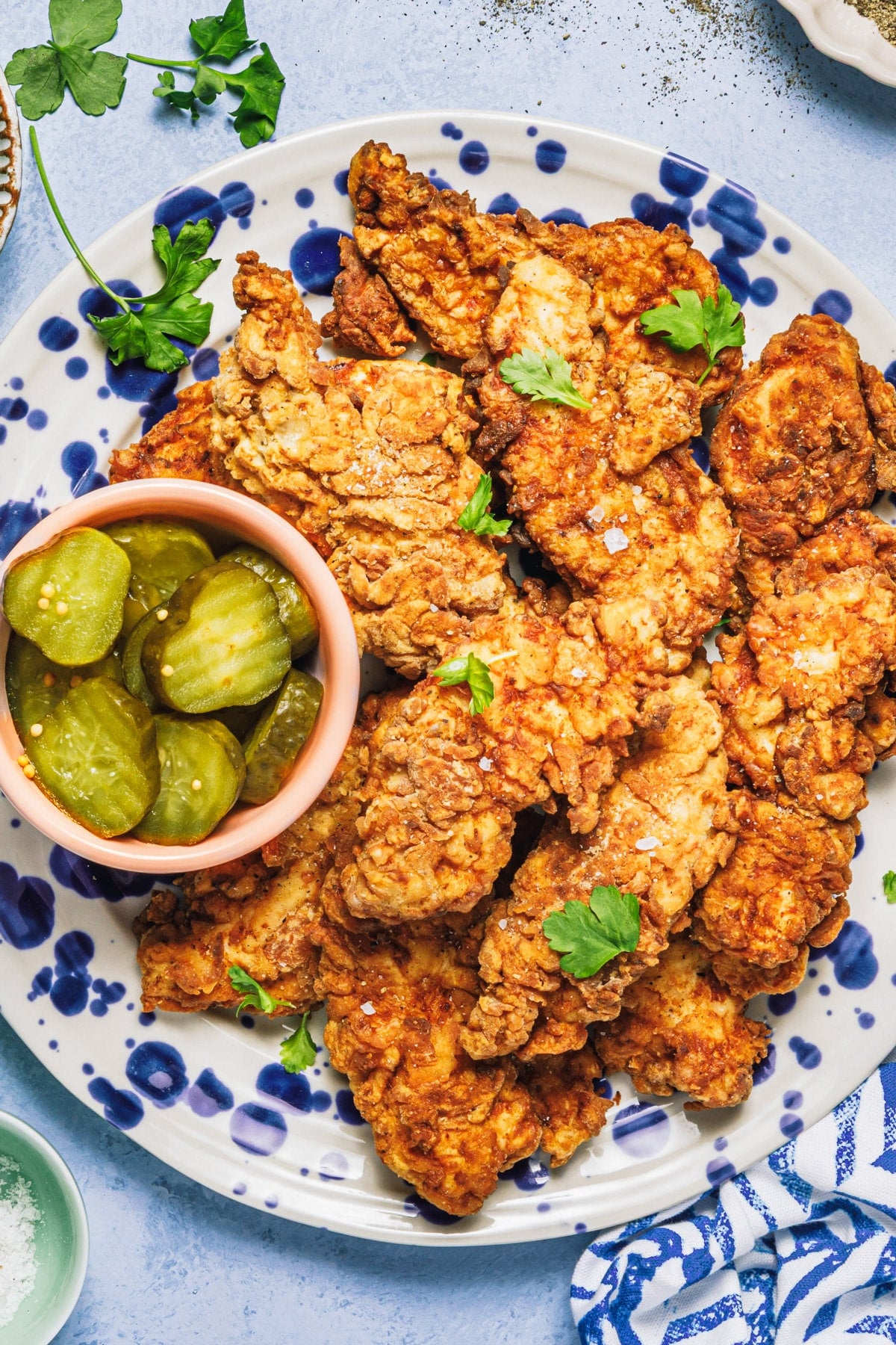 Close overhead shot of a platter of fried chicken tenders.