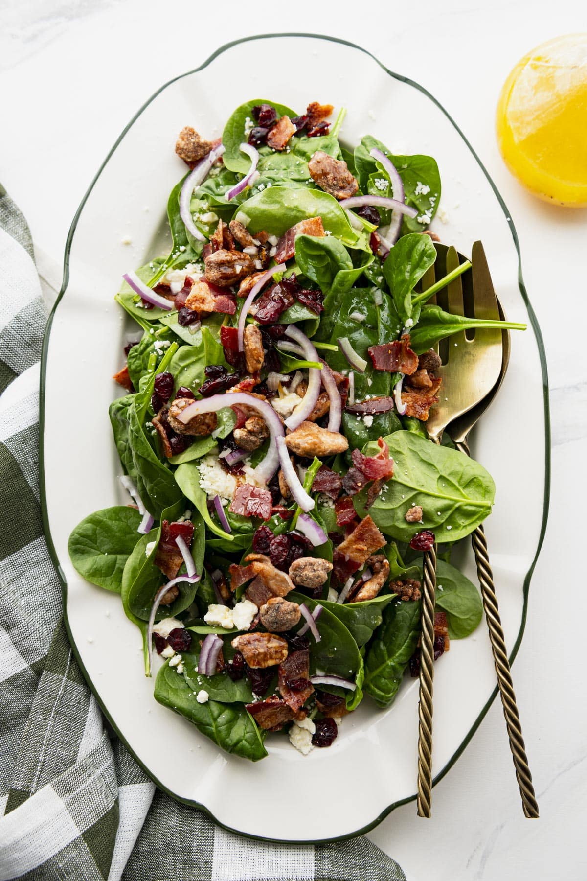 Winter spinach salad on a white table.