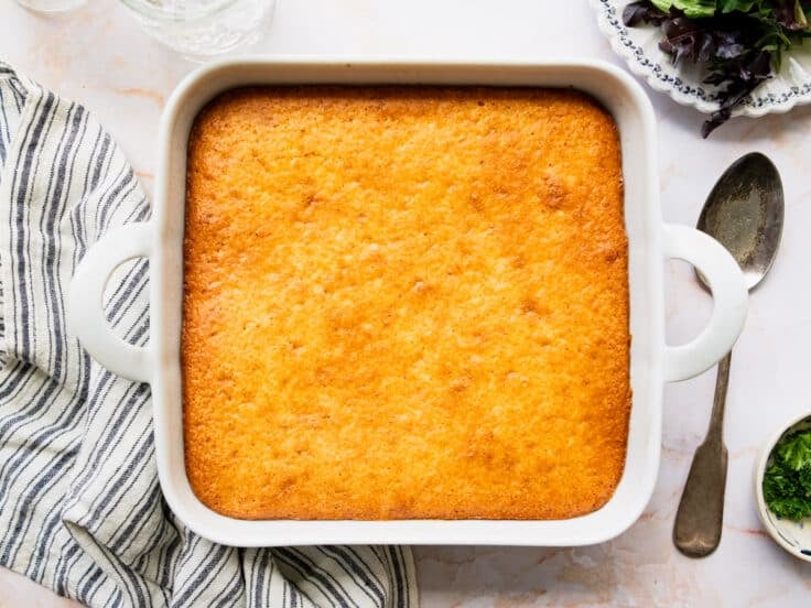 Horizontal overhead shot of a finished, baked cornbread and ground beef casserole.