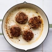 Browning poor man's steak patties in a skillet.