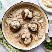 Horizontal overhead shot of a pan of hamburger steak with gravy.